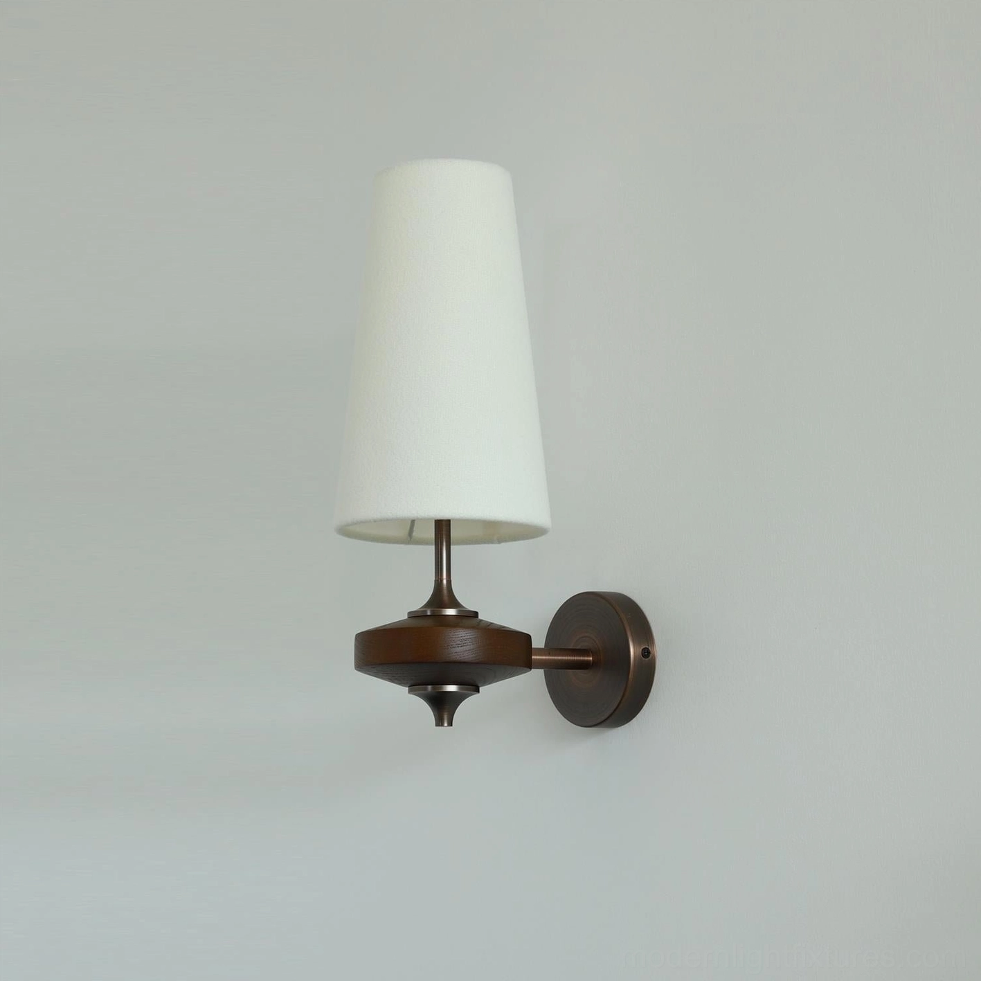 Montera mid-century wall sconce detail view of conical shade and antique brass base hardware