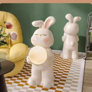 Two moon rabbit floor lamps in modern living room with checkered rug and yellow armchair