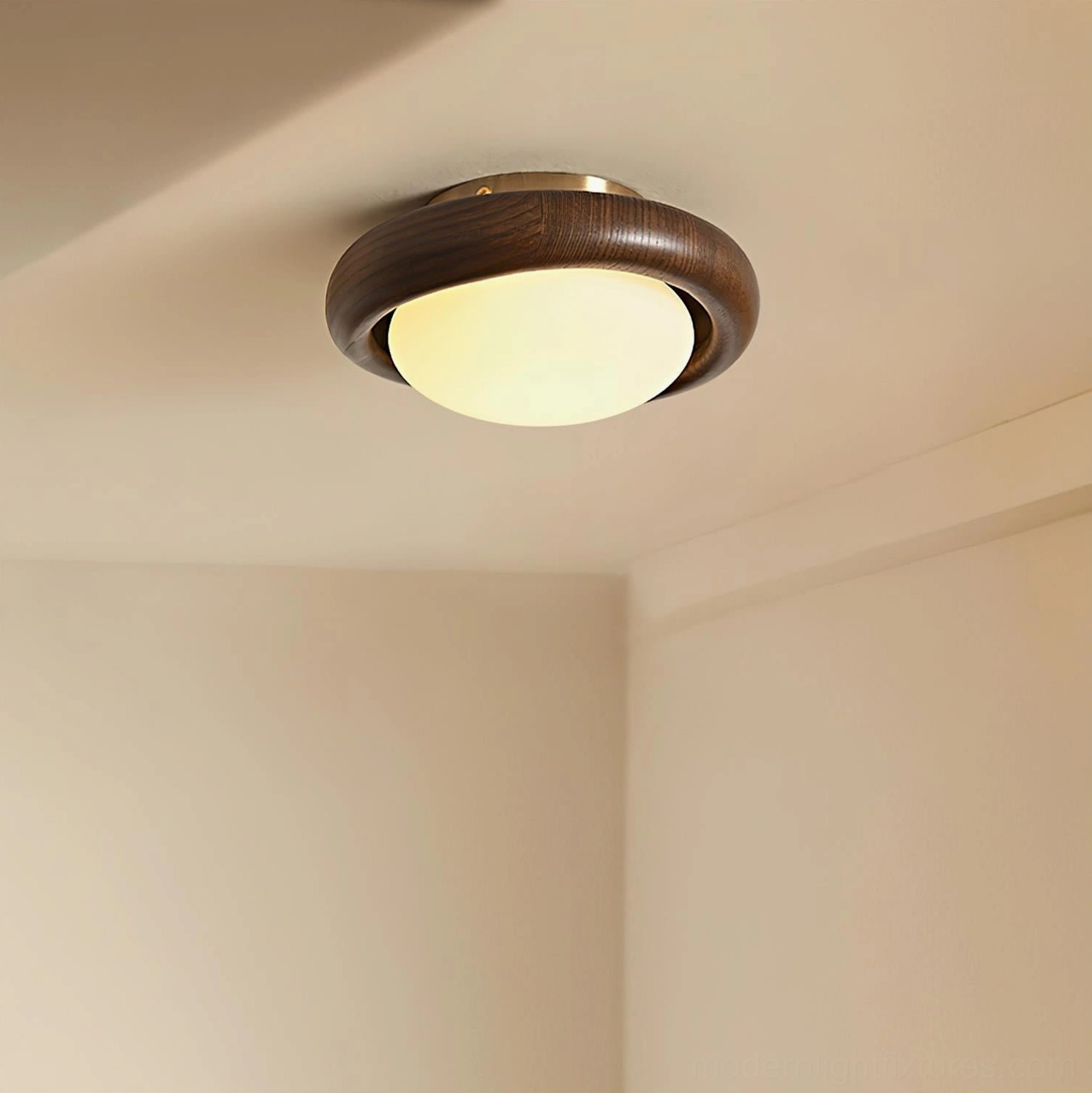 Modern flush mount ceiling light in warm-toned bedroom with subtle warm glow wood frame matching wall tone