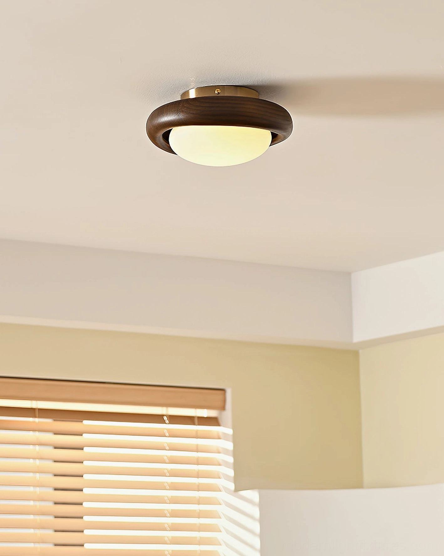 Walnut wood ceiling light fixture in living room blending with neutral warm home interior and window blinds