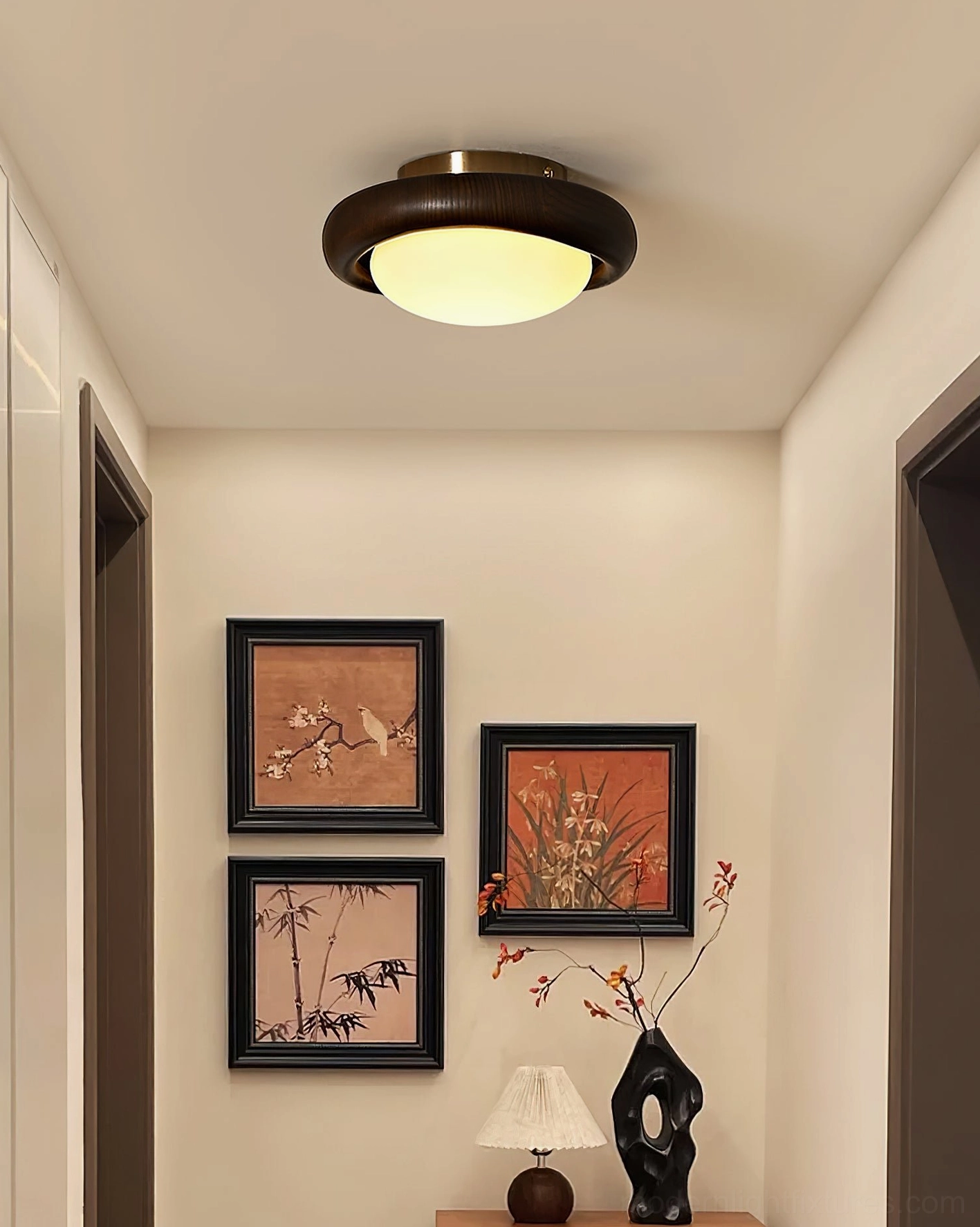 Modern ceiling light fixture mounted in hallway with warm neutral home décor and neutral wall tones