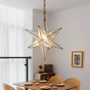 Moravian star pendant light installed above wooden dining table in apartment dining area