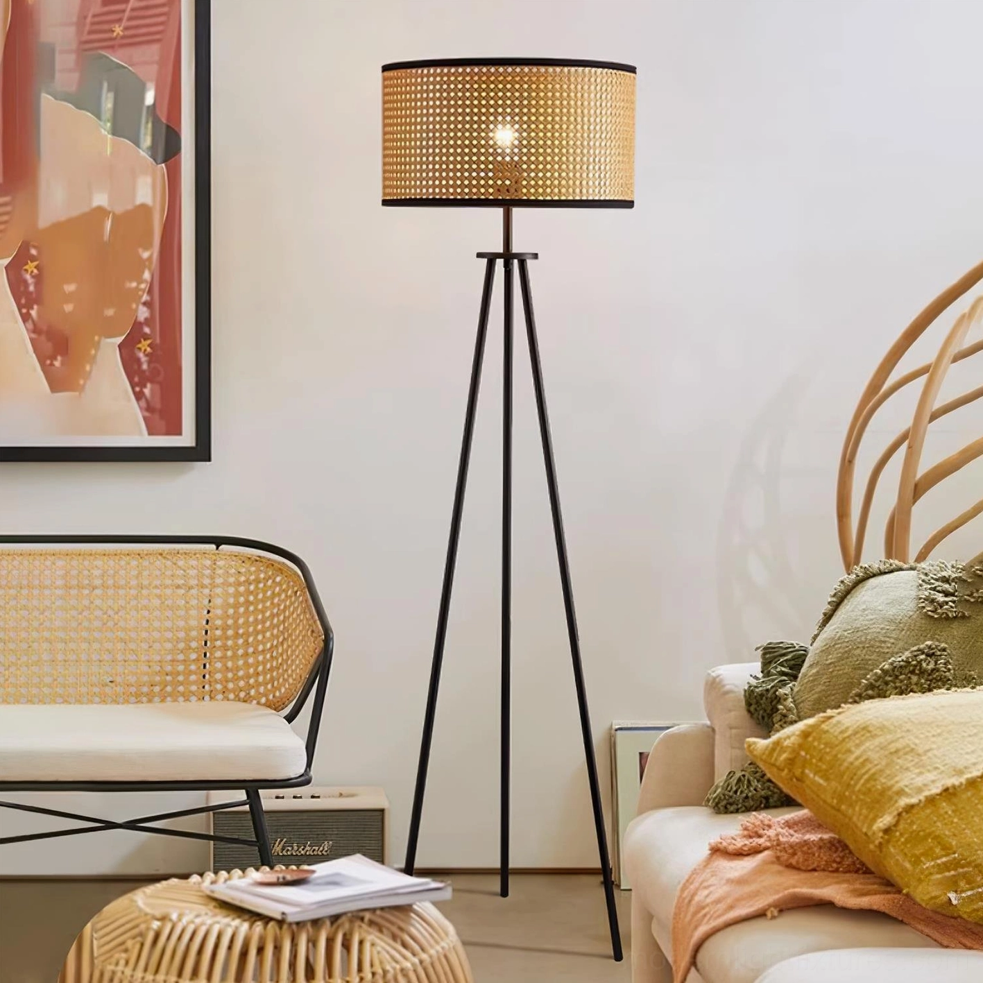Handwoven rattan drum shade tripod floor lamp in modern living room with warm lighting