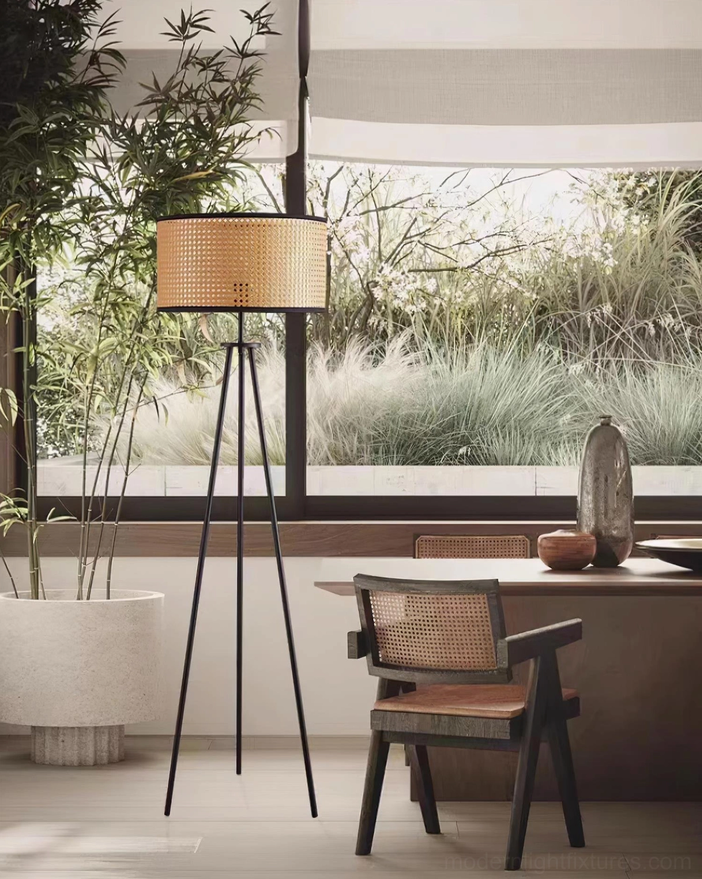 Black metal tripod base natural rattan drum shade floor lamp stability