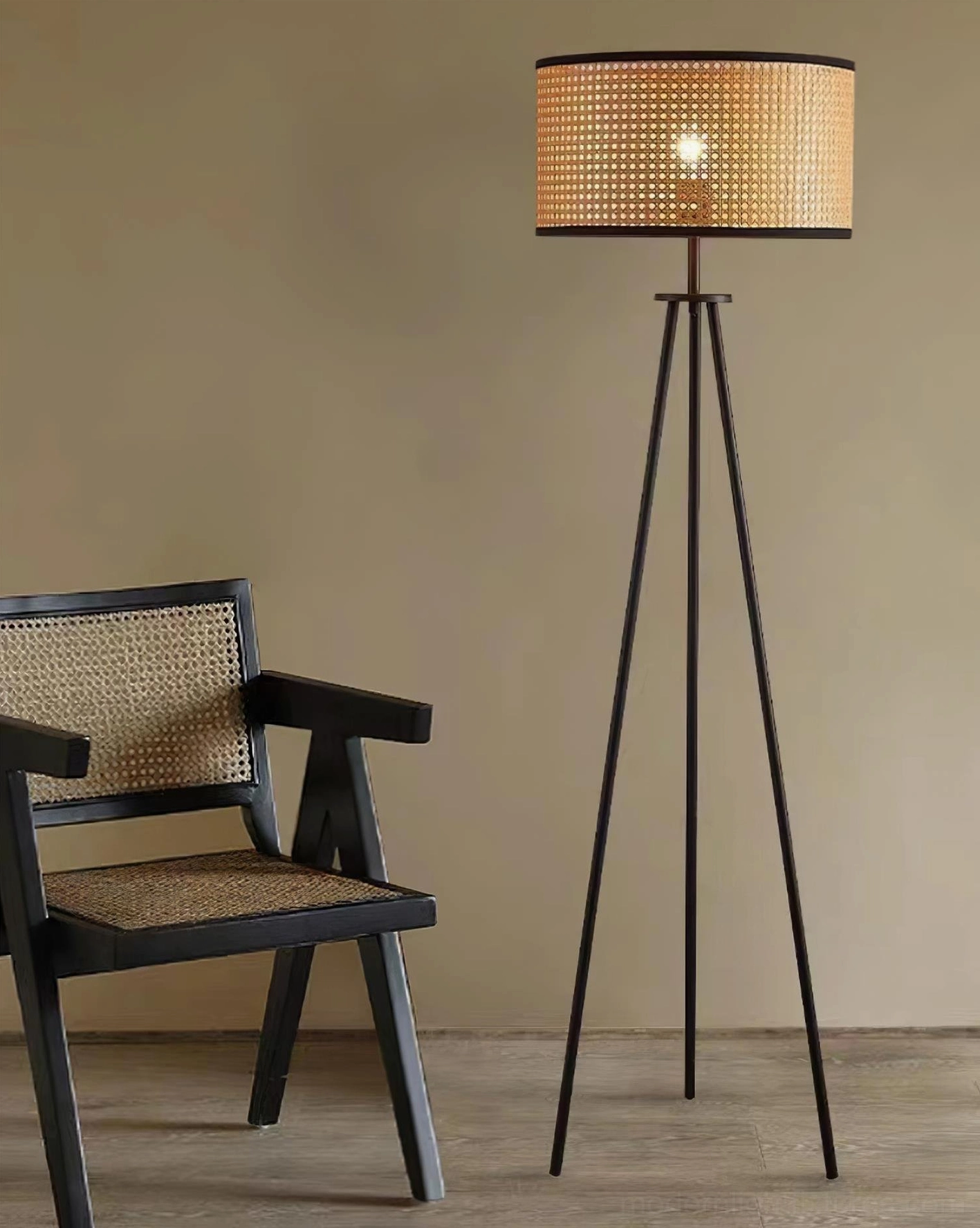 Handwoven rattan drum floor lamp black tripod base modern minimalist aesthetic