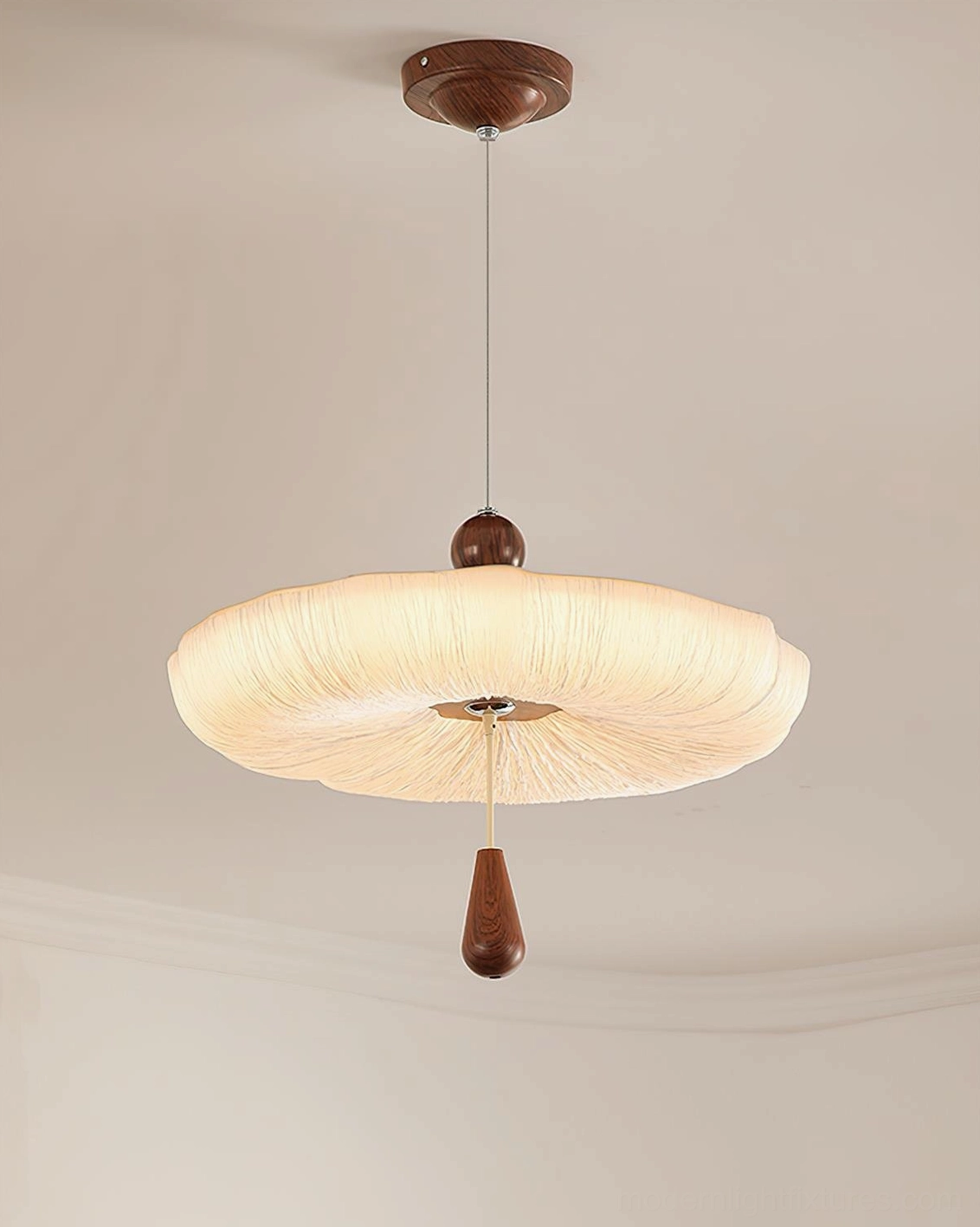 Flat front view of Mori Puff Pendant Light showing smooth cream fabric shade and sculptural puff design
