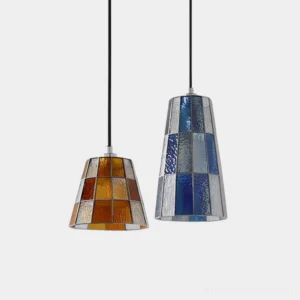 Two artisan mosaic glass pendant lights with stained glass trapezoid shades displayed side by side on white background - compact and statement sizes available