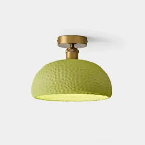Avocado green semi-flush ceiling light with hammered textured resin shade and brass gold base - front view