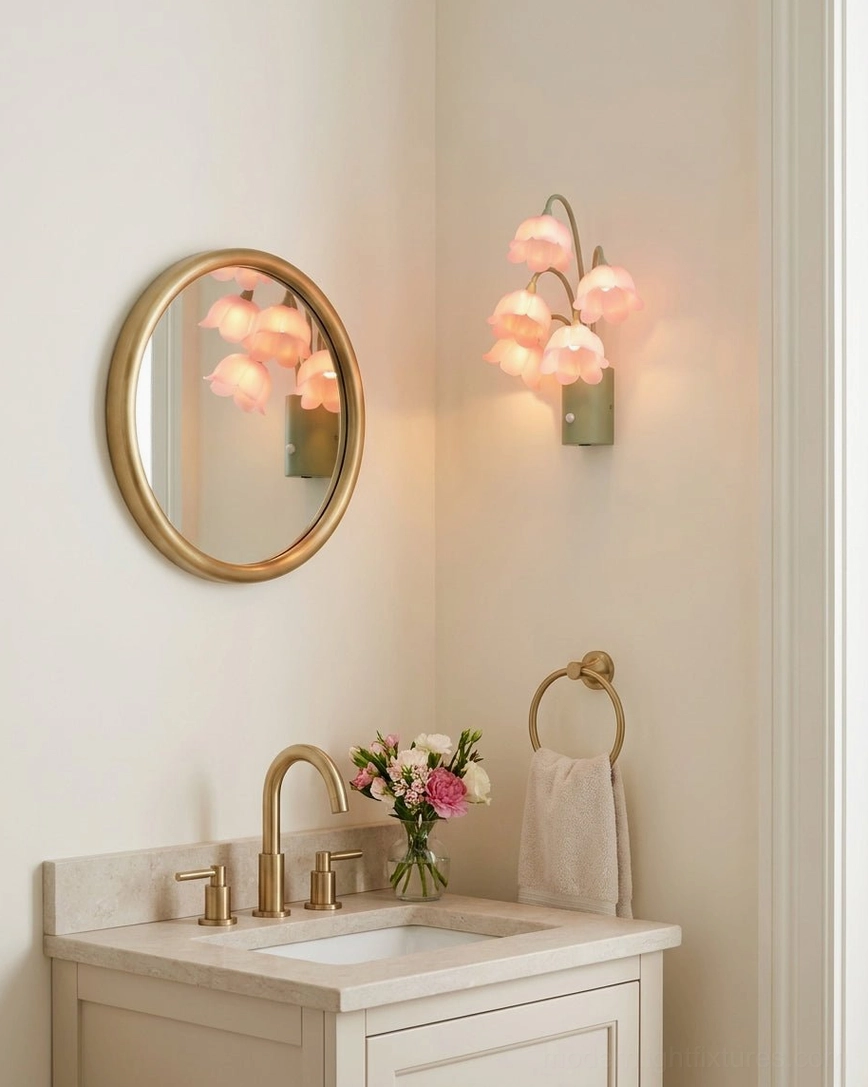Rechargeable motion-sensor floral wall sconce with pink flowers installed in farmhouse bathroom above wooden vanity with gold mirror