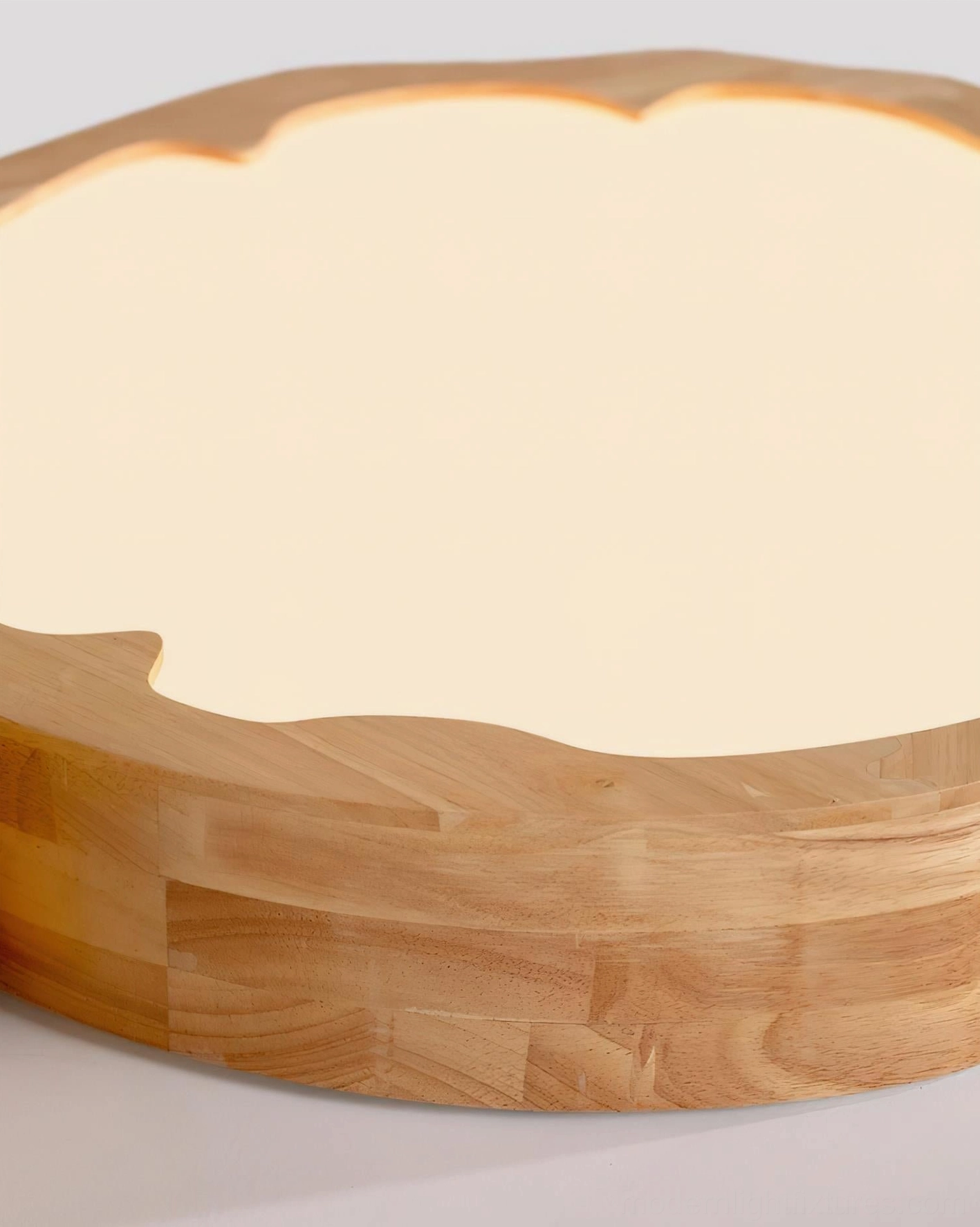 Handcrafted animal ceiling lamp mounted above child's bed with decorative wood frame and figurine