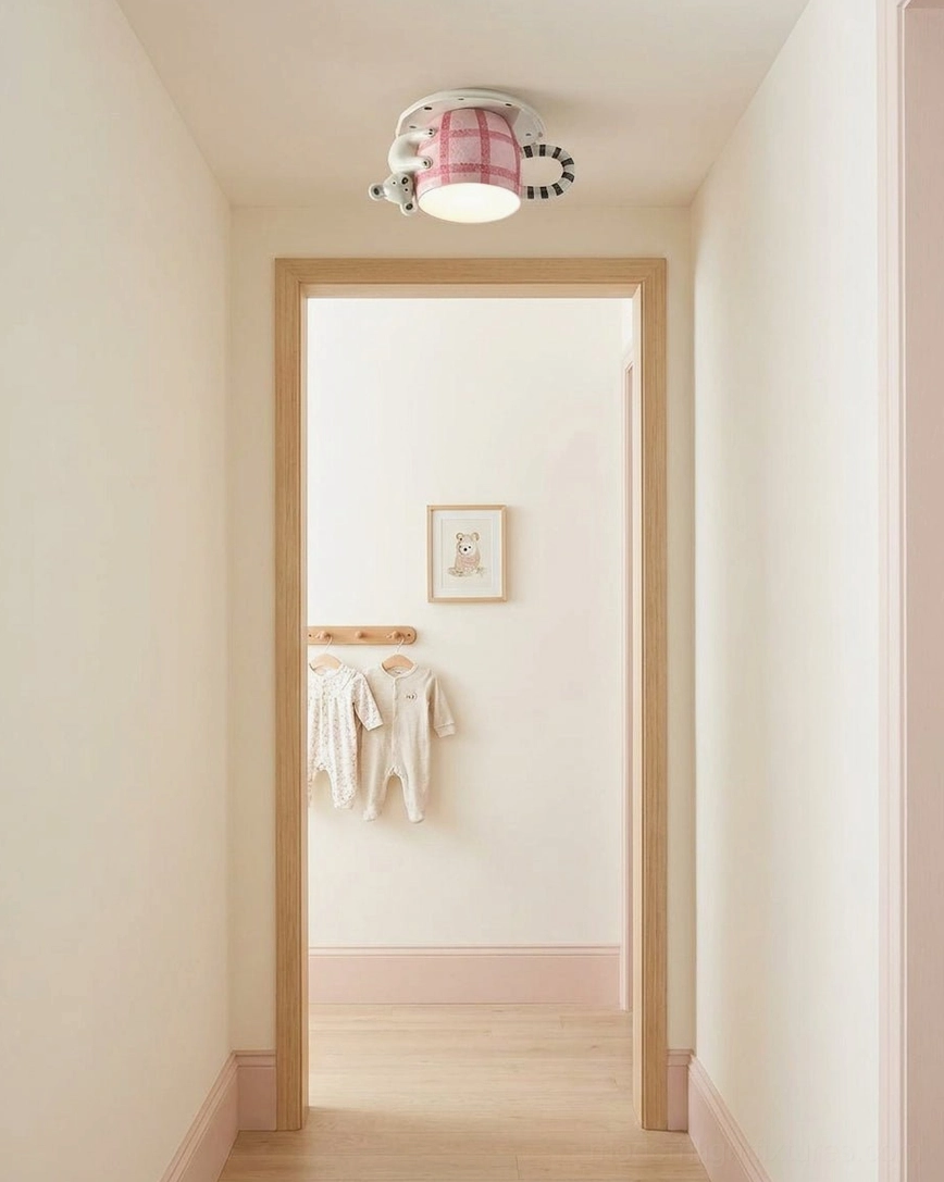 Whimsical mug flush mount light in minimalist hallway entryway, light wood trim interior