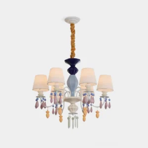 Front view of modern pastel ceramic multi-arm chandelier with blue accents and white pleated shades on white background