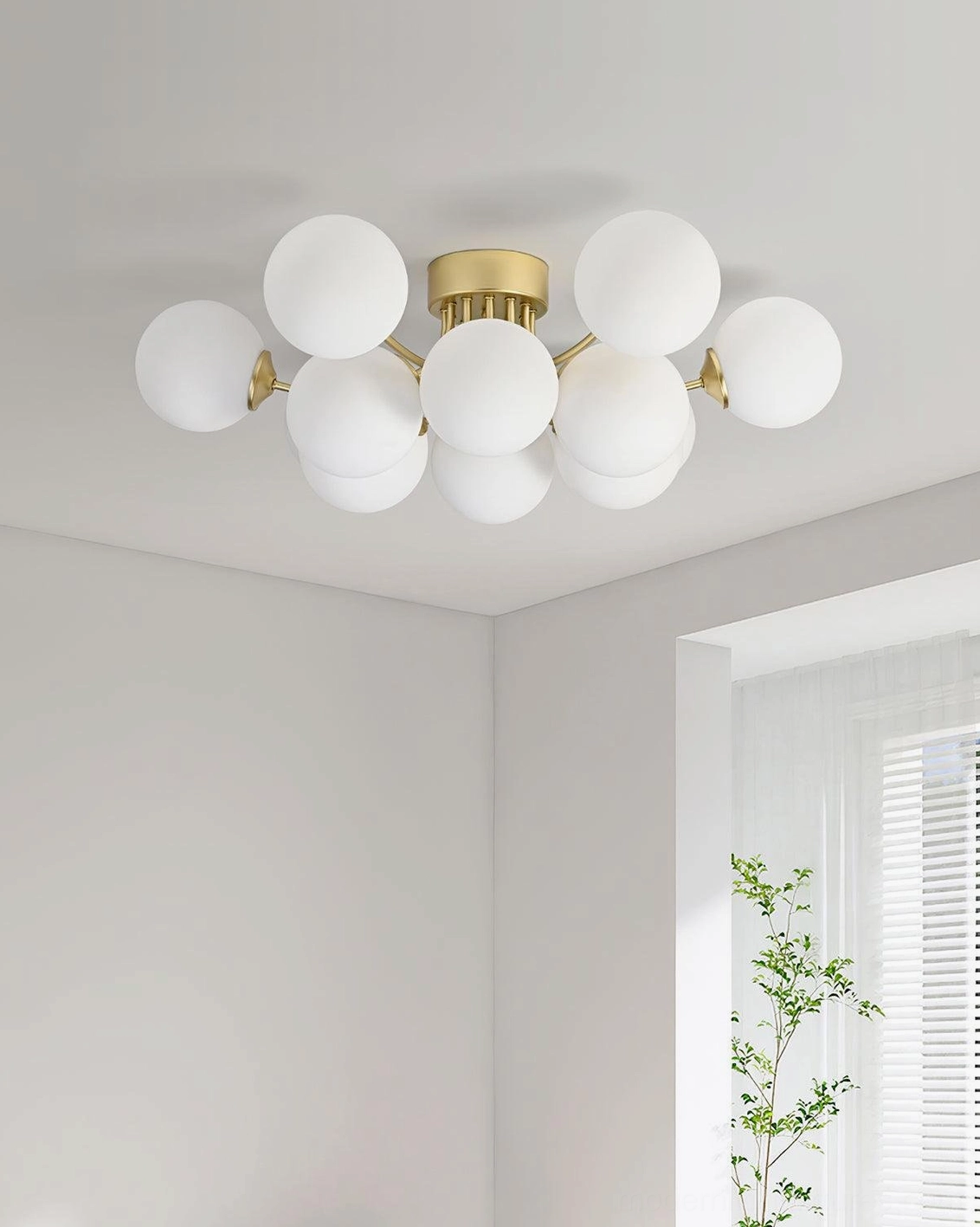 Multi-ball ceiling light fixture detail showing quality brass gold construction and glass sphere design