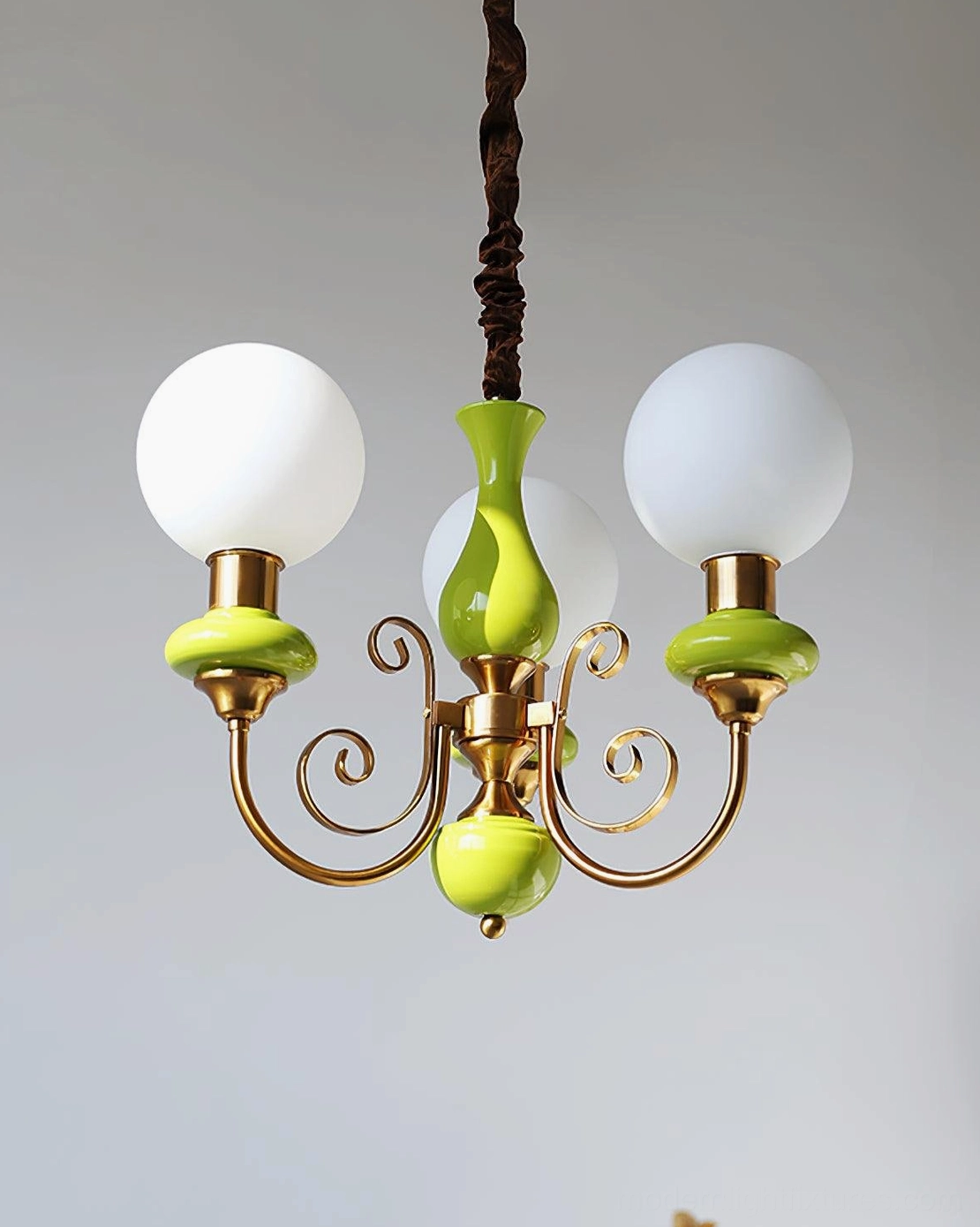 Multi-fixture glass chandelier overhead installation, mid-century modern style lighting