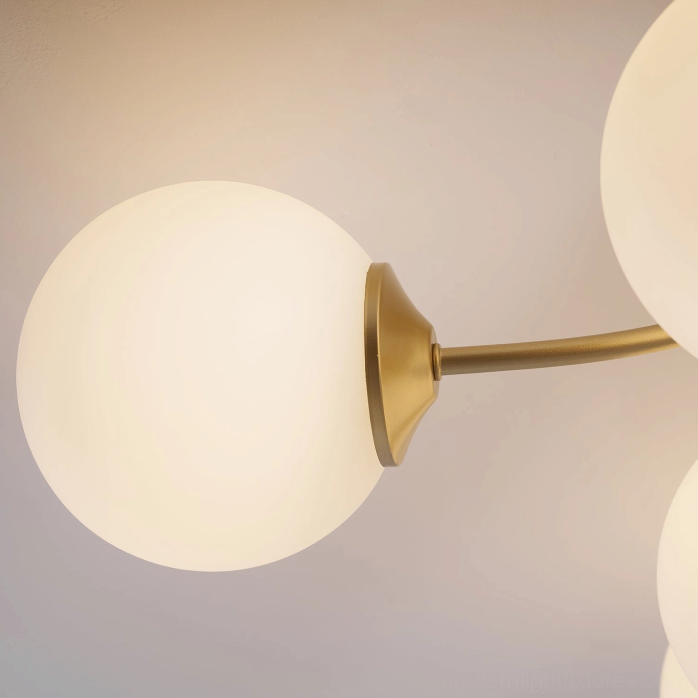 Multi-head sputnik ceiling light showing complete spherical glass shade coverage and distribution