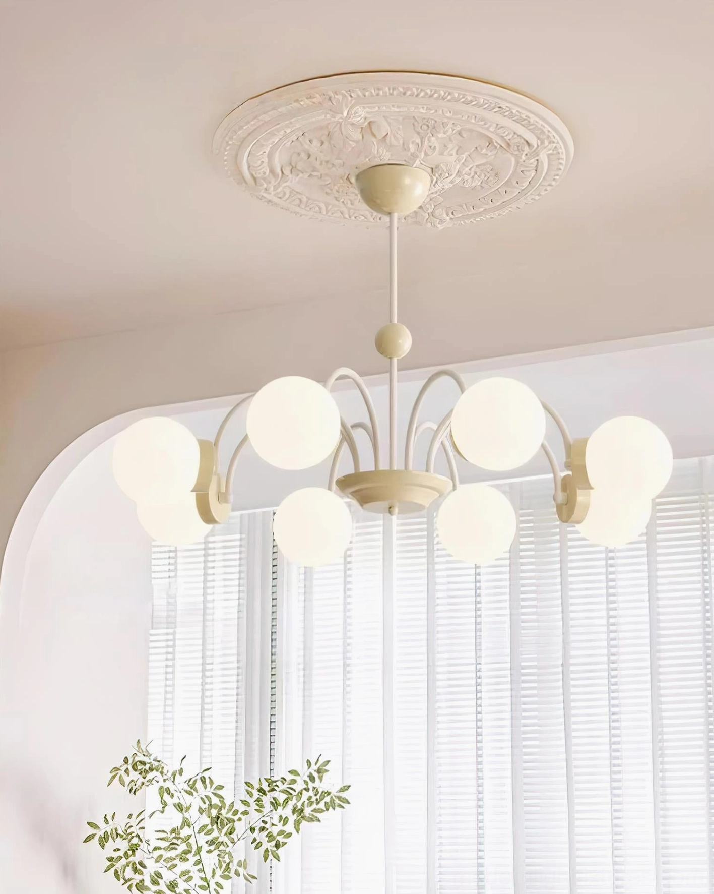 Multi-head glass globe chandelier, elegant curved metal framework and hanging fixture detail