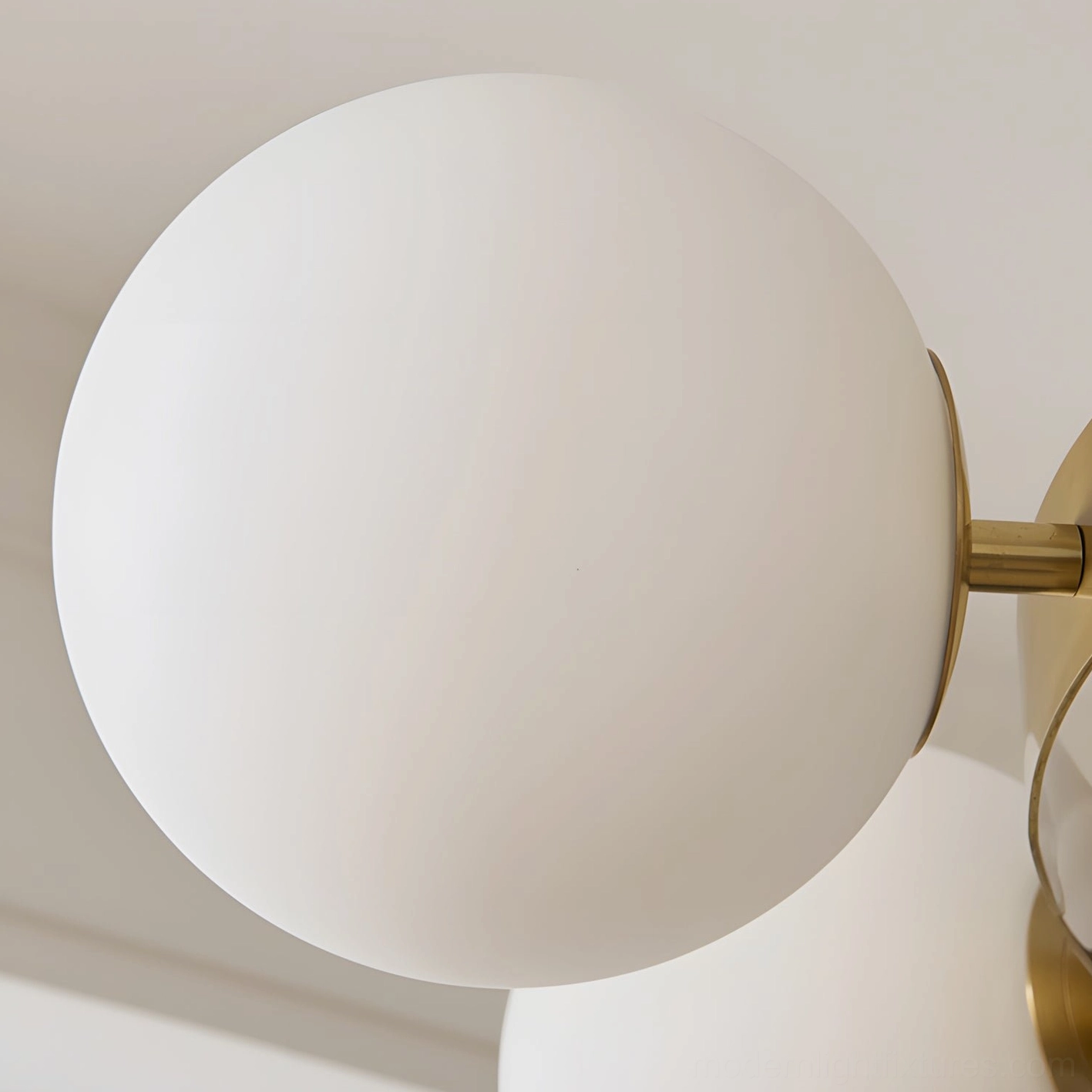 Multi-head sputnik chandelier with brass metal frame and glass globe light diffusers modern fixture