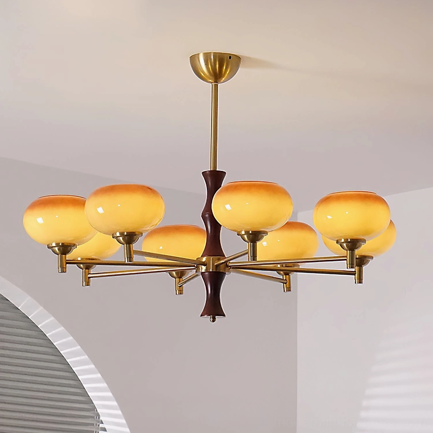 Multiple-head mid-century vintage chandelier showcasing brass frame structure, wood column accent, and gradient glass sphere design