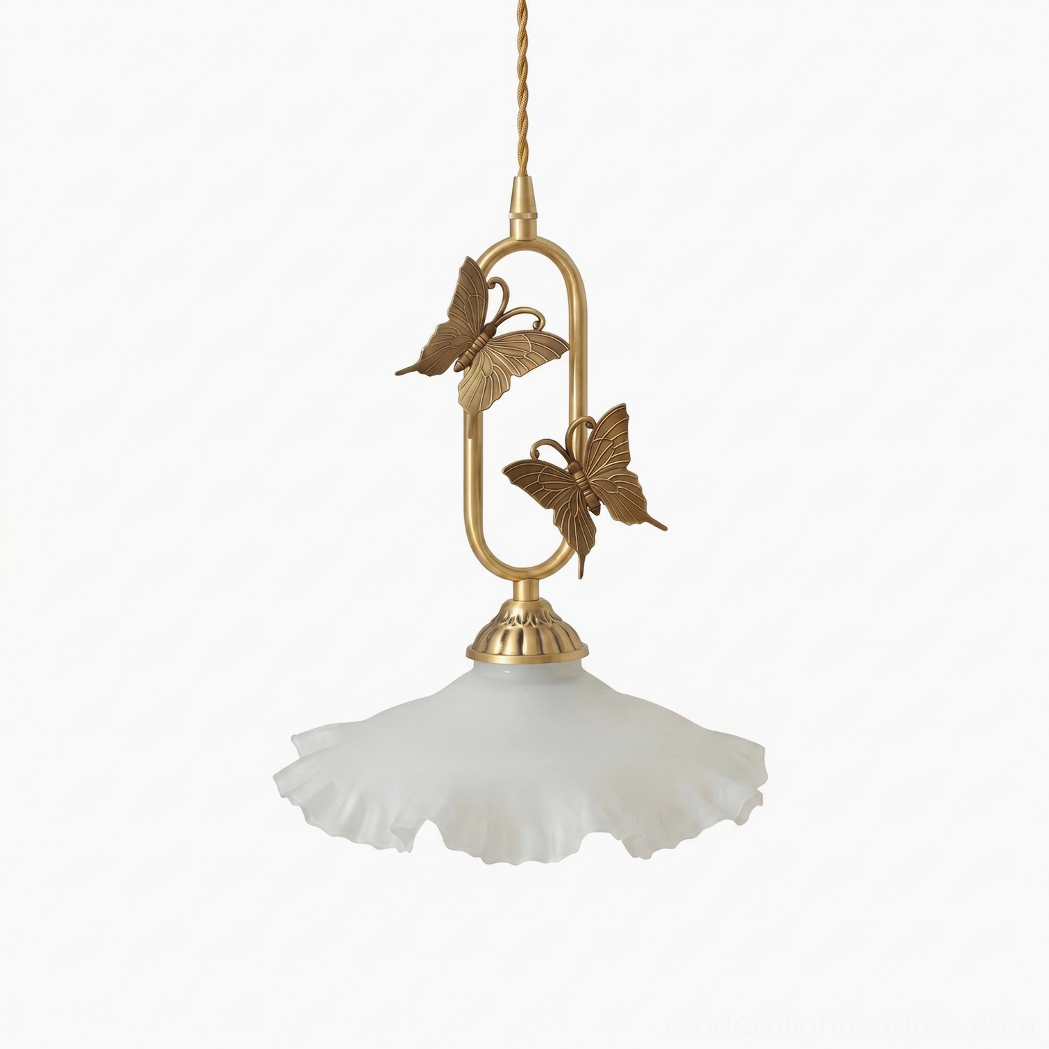 Multiple brass butterfly pendant light fixtures hung in dining room row, white jade shades creating ambient lighting