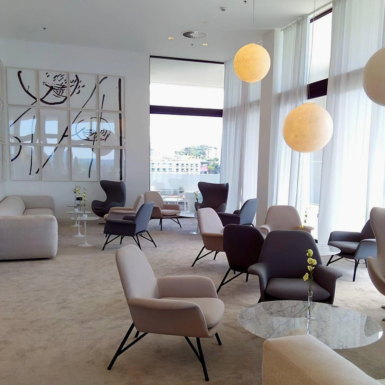 Multiple moon pendant lamps constellation installation staggered heights dining