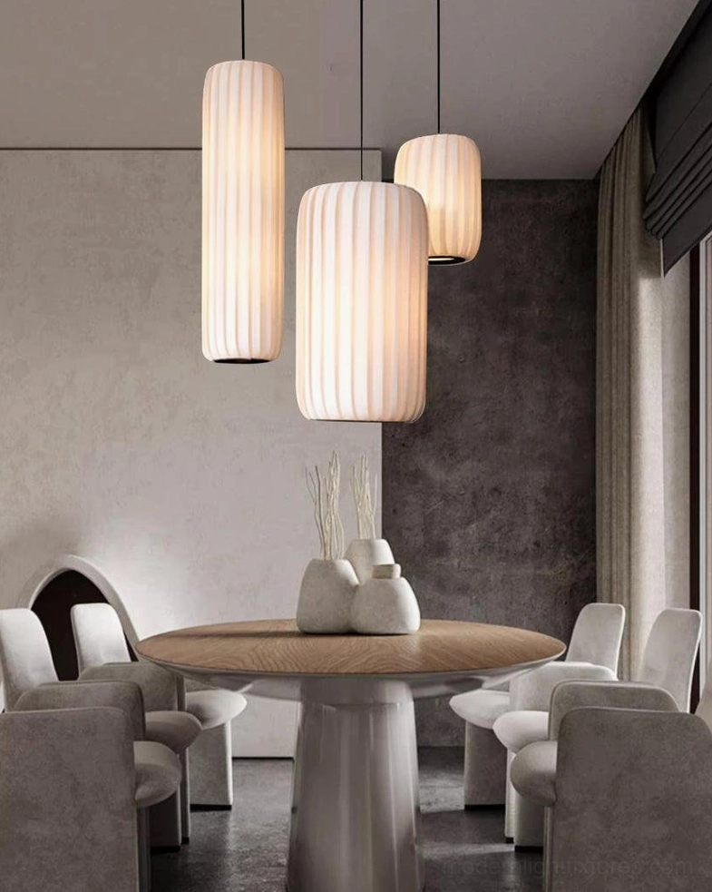 Clustered Rossau pendant lights creating cohesive modern lighting design in open concept space