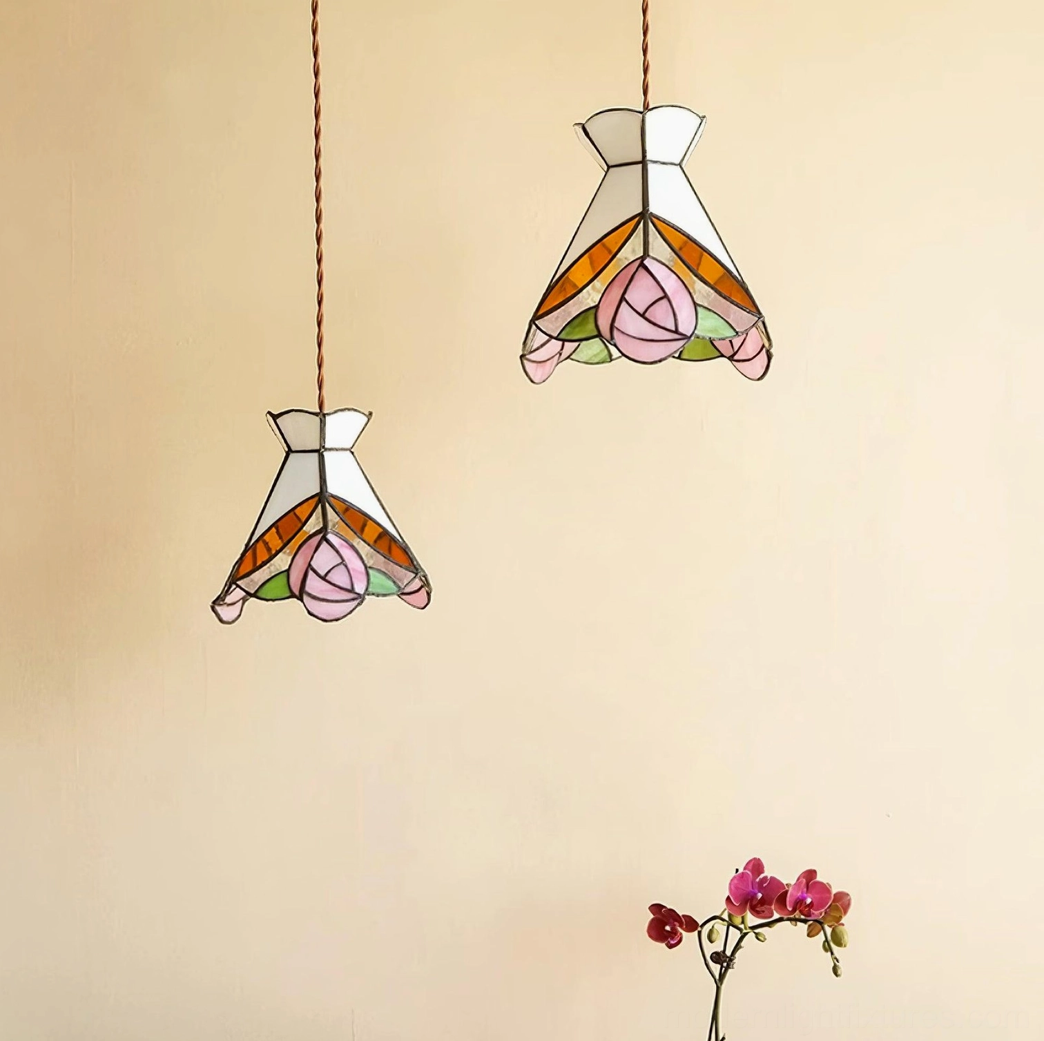 Two vintage Tiffany rose pendant lights suspended in minimalist interior with orchid decor below