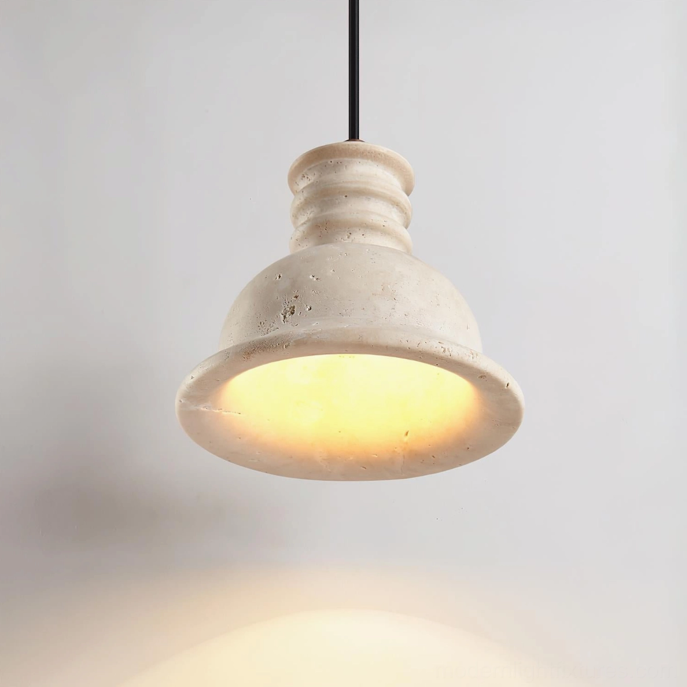 Multiple travertine pendant lights in coordinated interior design scheme showing versatile placement and grouped aesthetic