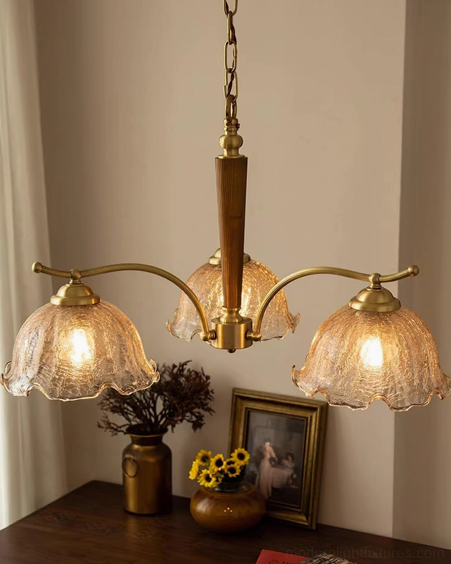 3-head vintage Murano chandelier with dark wood central rod and brass arms in retro indoor setting