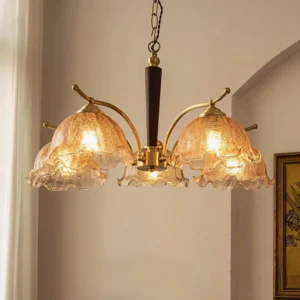 Overhead perspective of 5-head Murano brass chandelier with ruffled cognac glass shades in warm home lighting