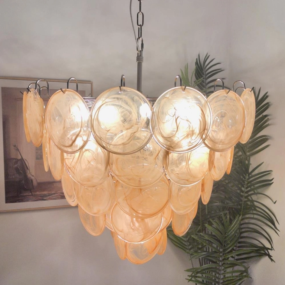 Orange Murano glass disc chandelier featuring natural iridescent shimmer and artistic glass design