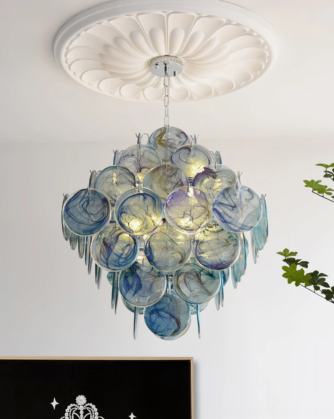 Murano-style glass disc chandelier in contemporary setting showing color tone and metallic hardware coordination