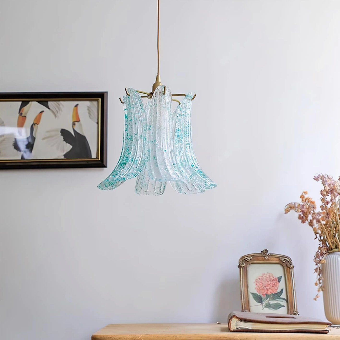 Blue speckled Murano glass lily pendant lamp with clear glass petals and brass cord, side table home display