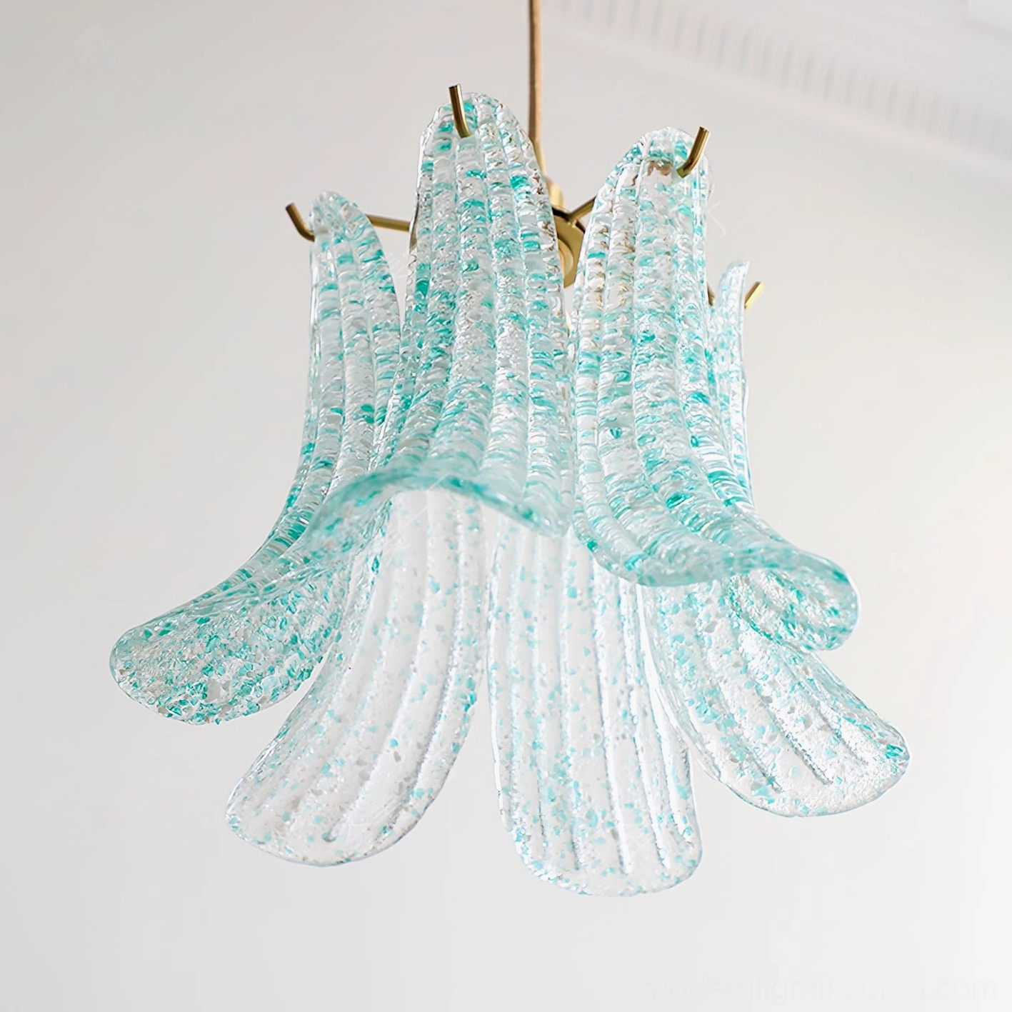 Blue speckled Murano glass lily pendant light with enlarged blown glass petals and brass hanging hardware