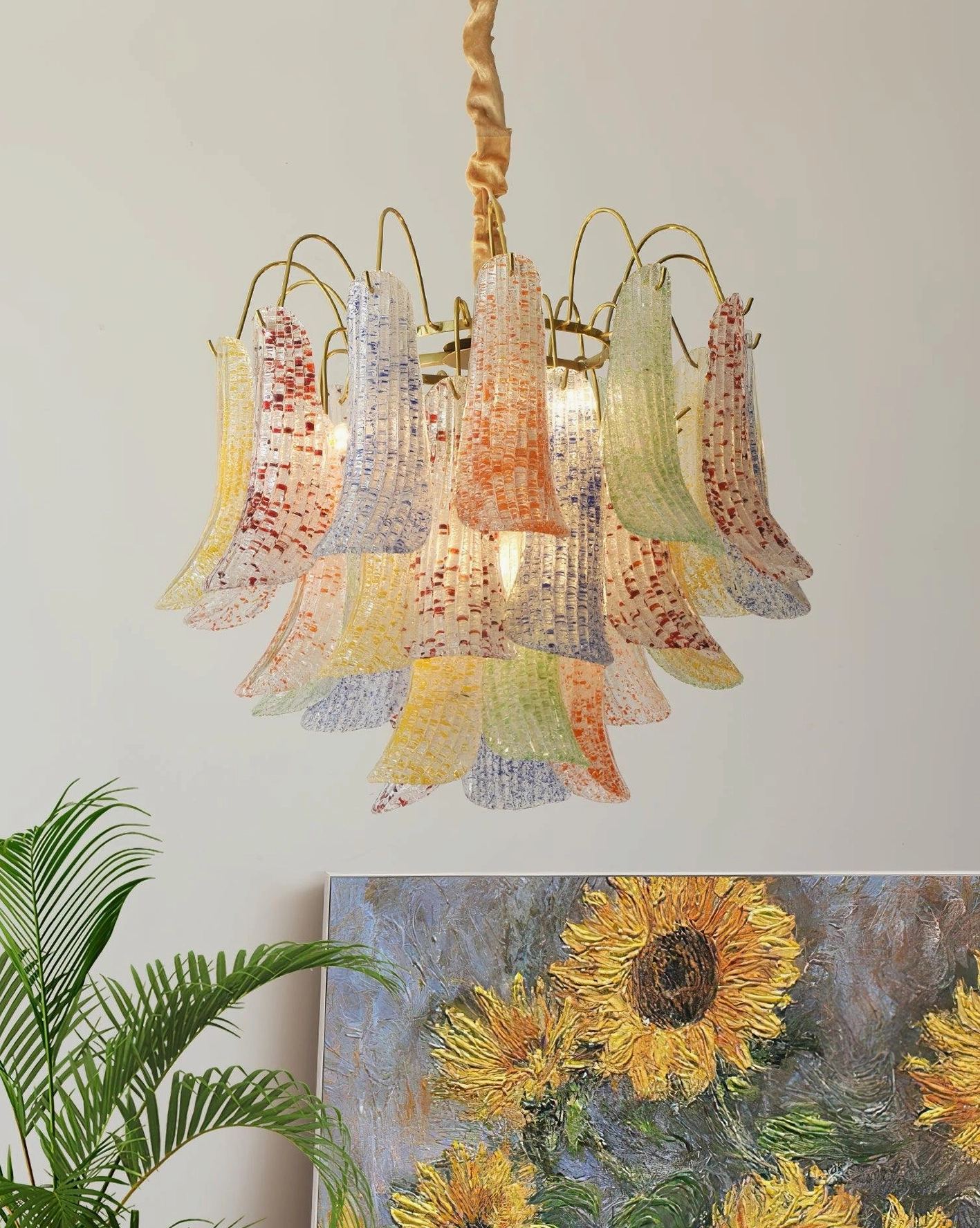 Symmetrical lily bell glass chandelier shades in Murano style with brass hardware, residential interior view
