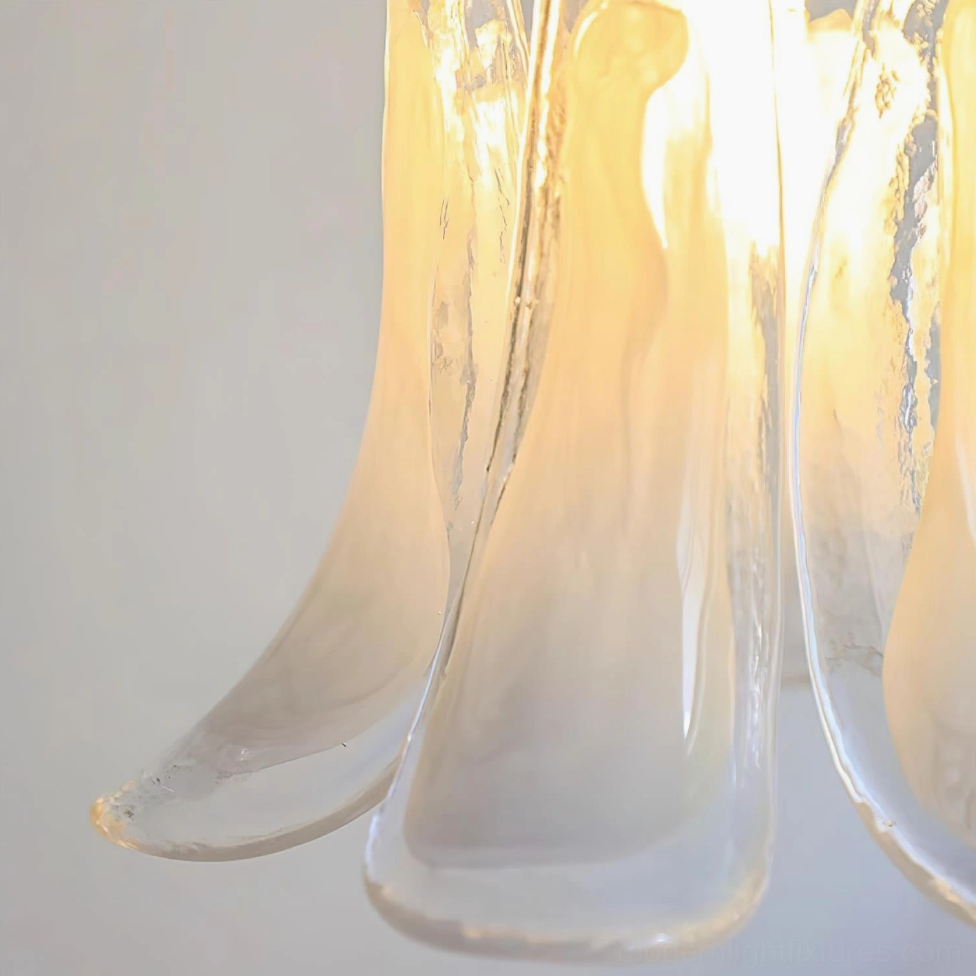 Murano glass pendant lamp installation detail showing E14 socket, brass fixture hardware, and cord adjustment capability
