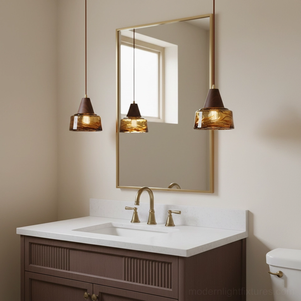 Three Murano glass vanity pendant lights installed above bathroom mirror