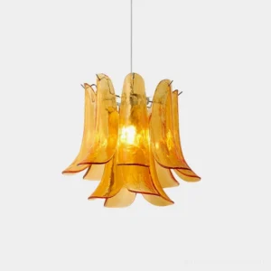 Murava handcrafted glass petal pendant light with amber translucent petals in studio setting
