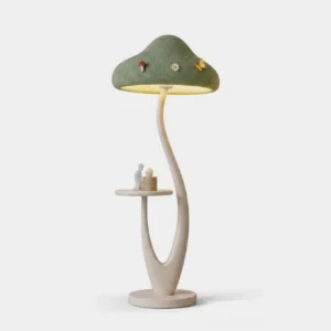 Mushora sculptural mushroom floor lamp with sage green textured cap, cream resin base, and integrated side tray—front view on white background