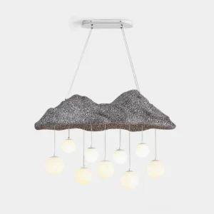 Mushroom cloud pendant chandelier with dark rocky textured top and warm glowing frosted glass bulb pendants, front overhead view on white background