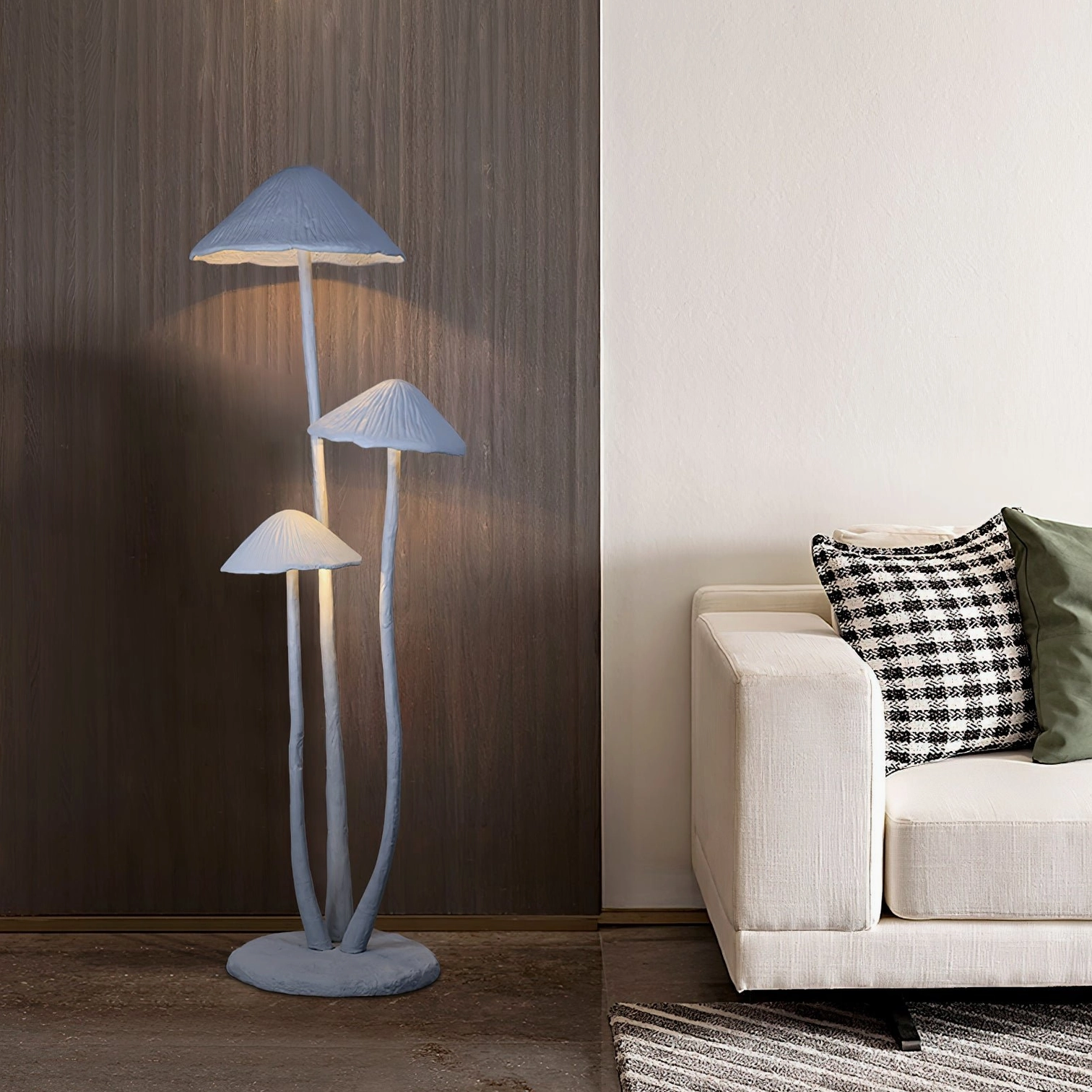 Modern mushroom lamp providing warm ambient lighting in contemporary living room with fabric sofa, three-quarter front view