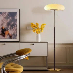 Pleated mushroom floor lamp in mid-century modern living room setting with wooden furniture