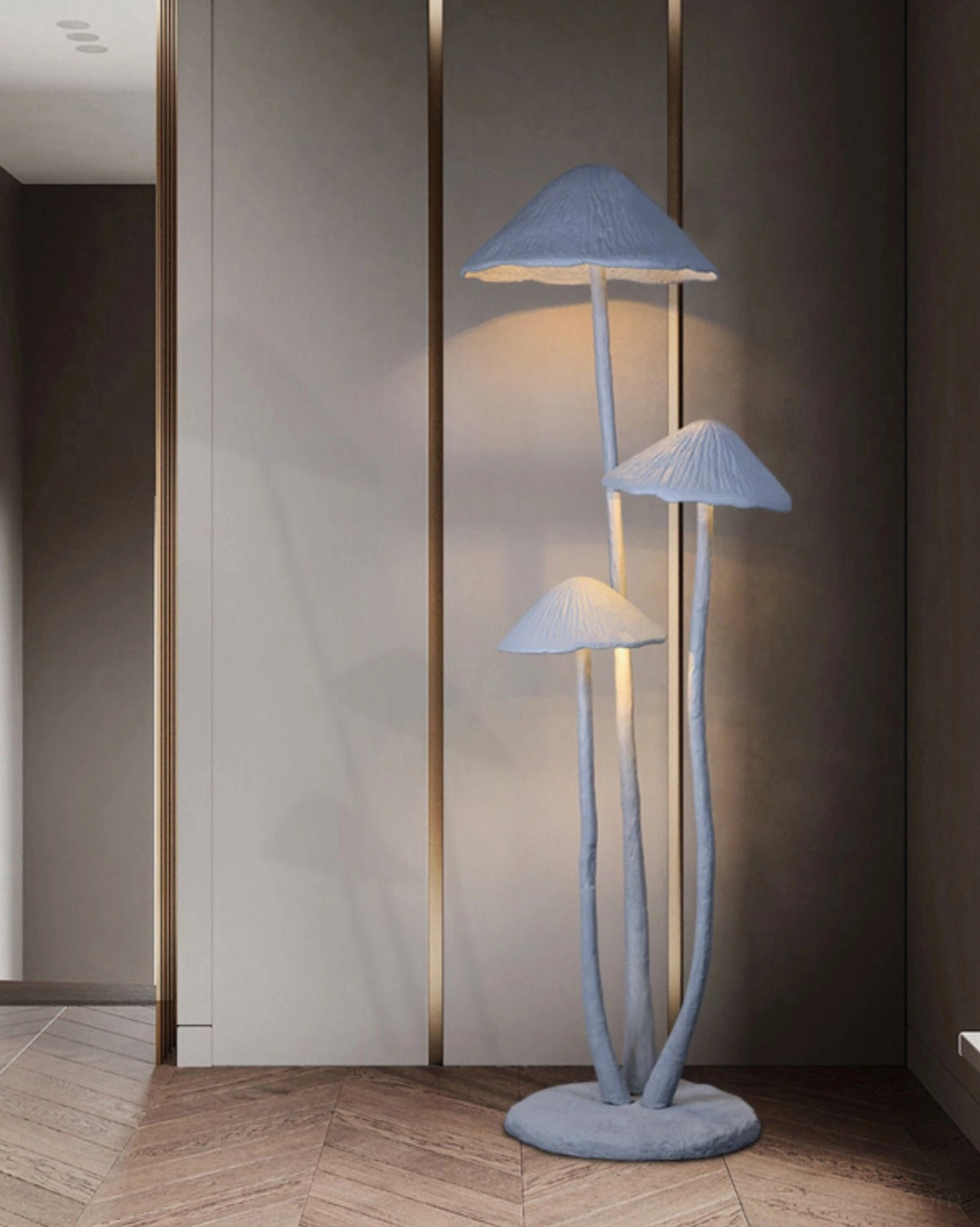 Sculptural mushroom lamp with gray matte finish in minimalist hallway with neutral decor, eye-level side view
