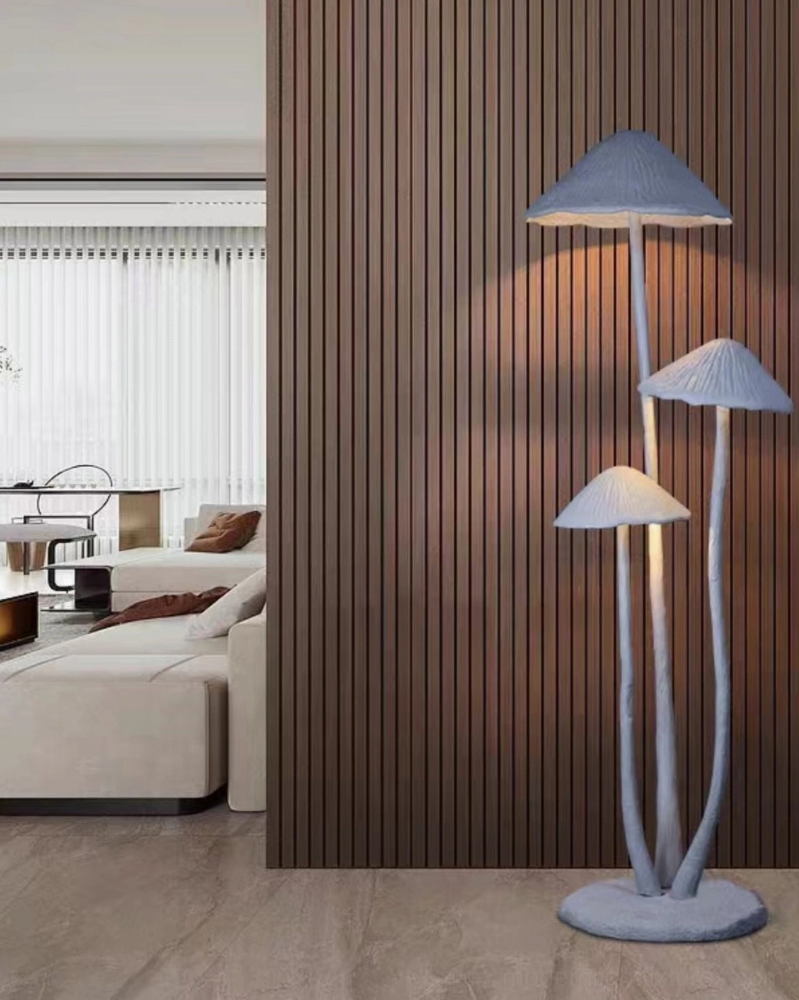 Contemporary mushroom sculptural floor lamp in modern living room interior with wood slat accent wall, cozy ambient light