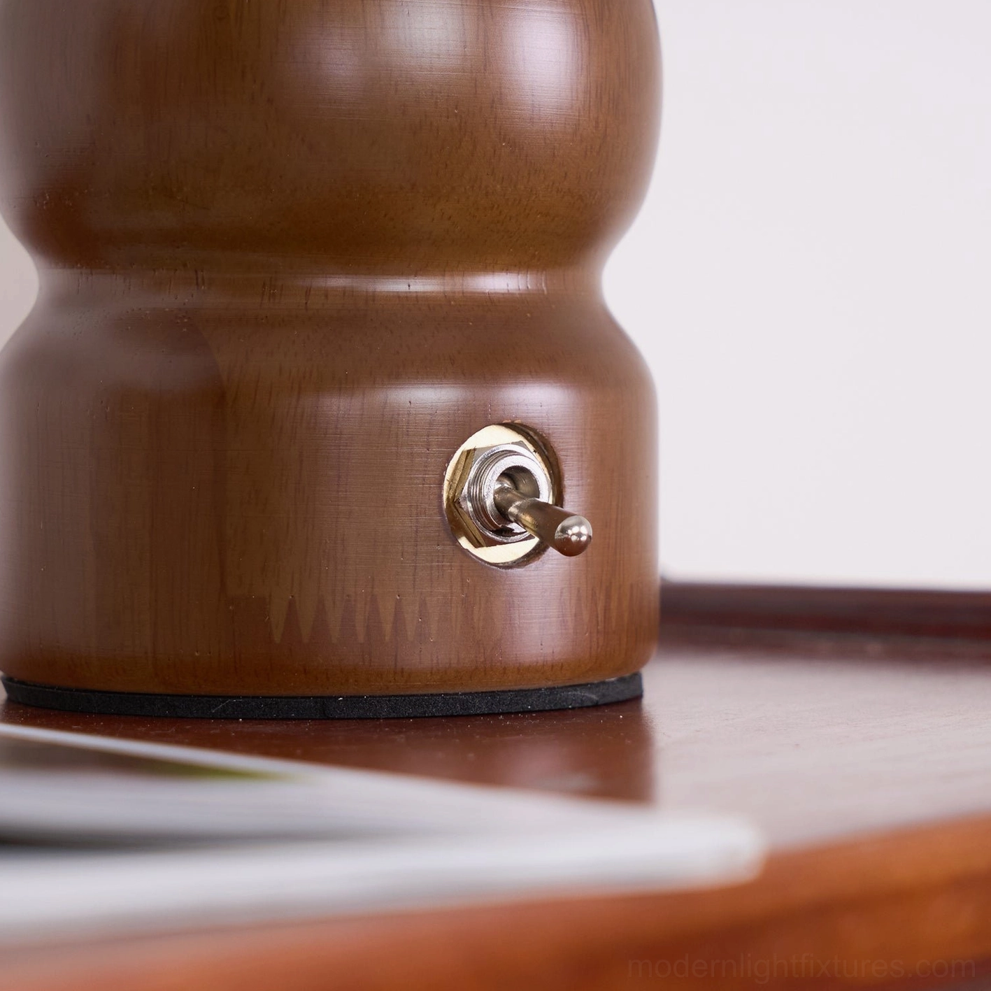 Contemporary mushroom lamp base detail showcasing quality wood craftsmanship and metal accents