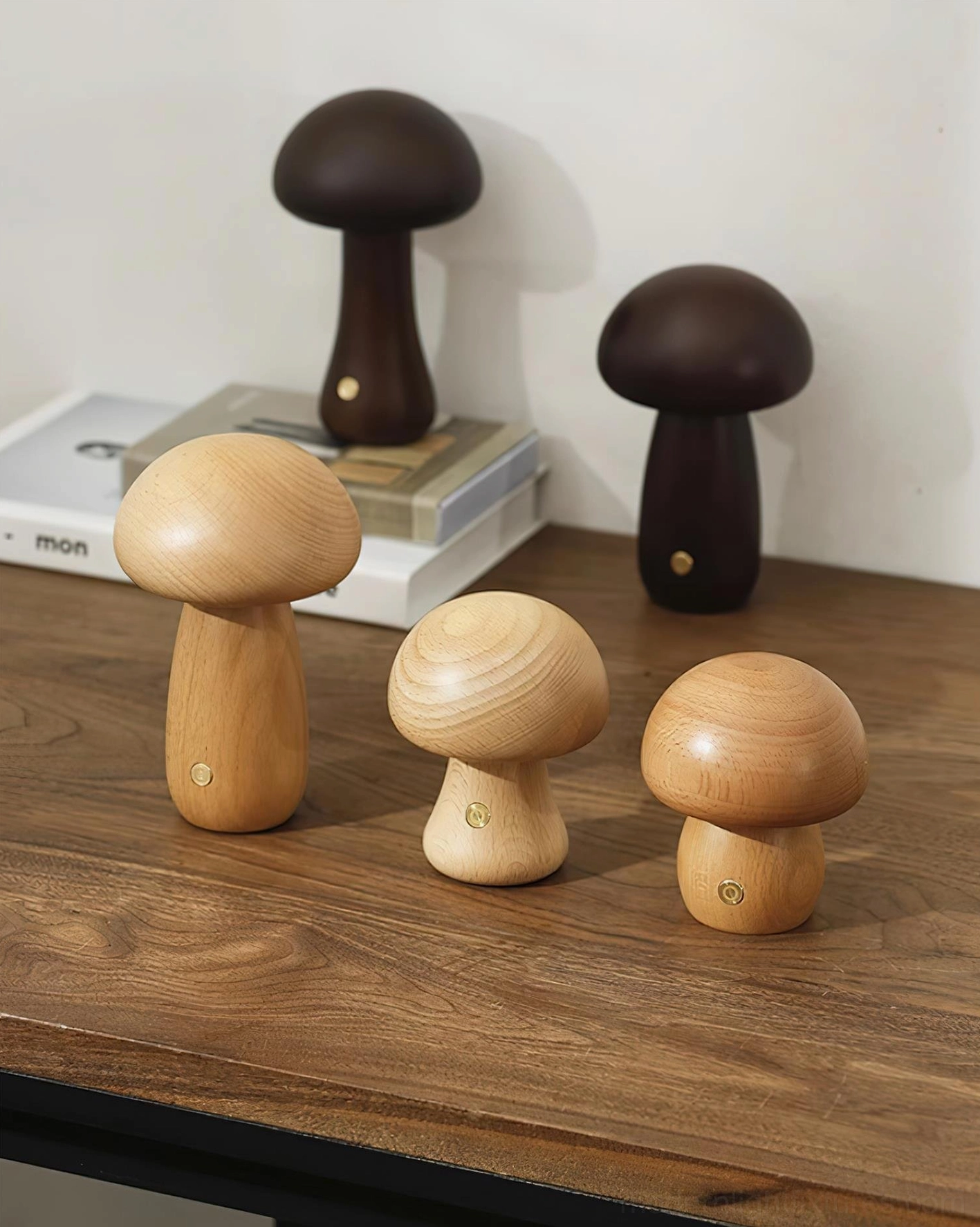 Wooden mushroom table lamp on bookshelf with curated styling objects demonstrating design versatility