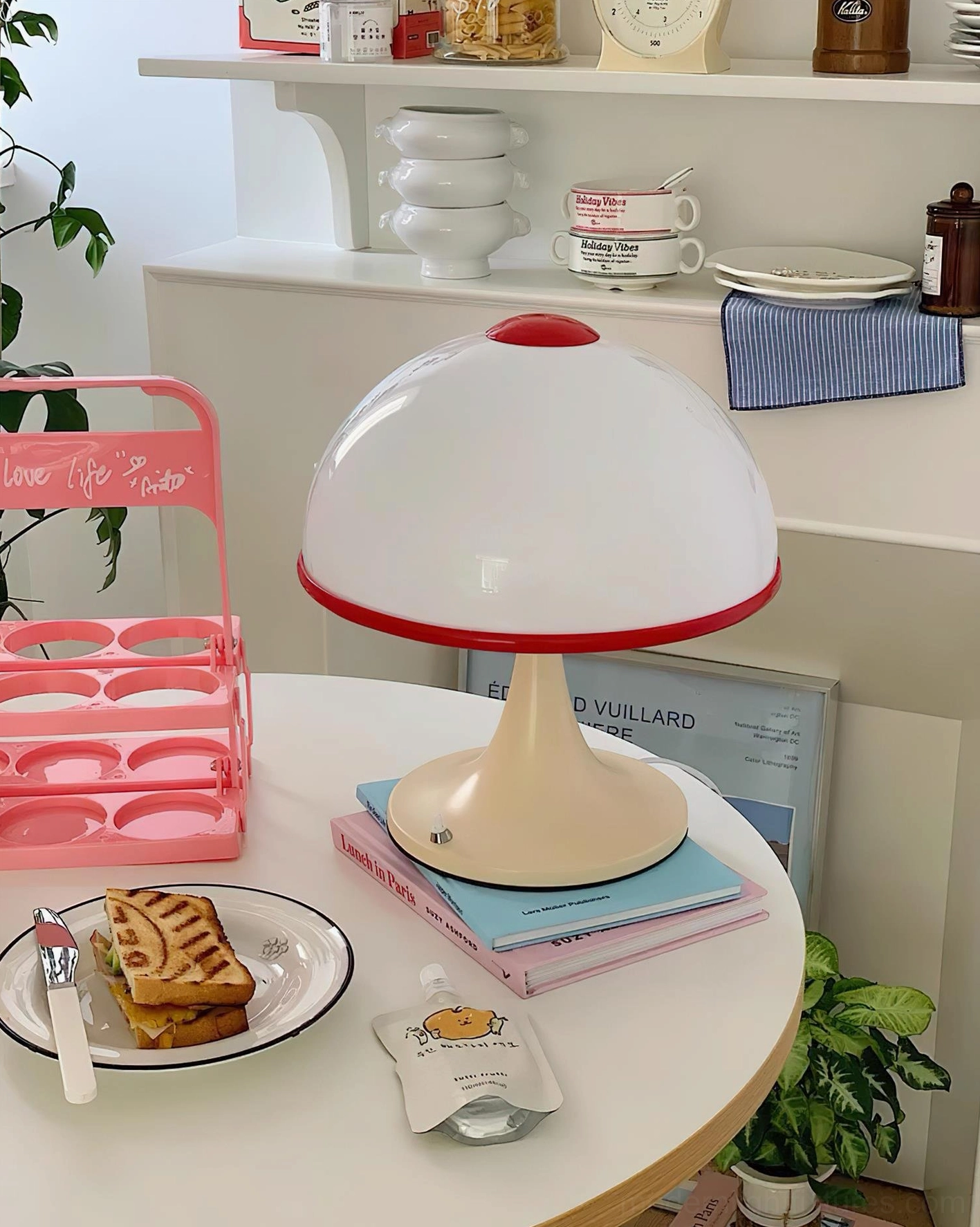 Mushroom table lamp casual home cafe table setting with dessert and stacked books retro ambiance