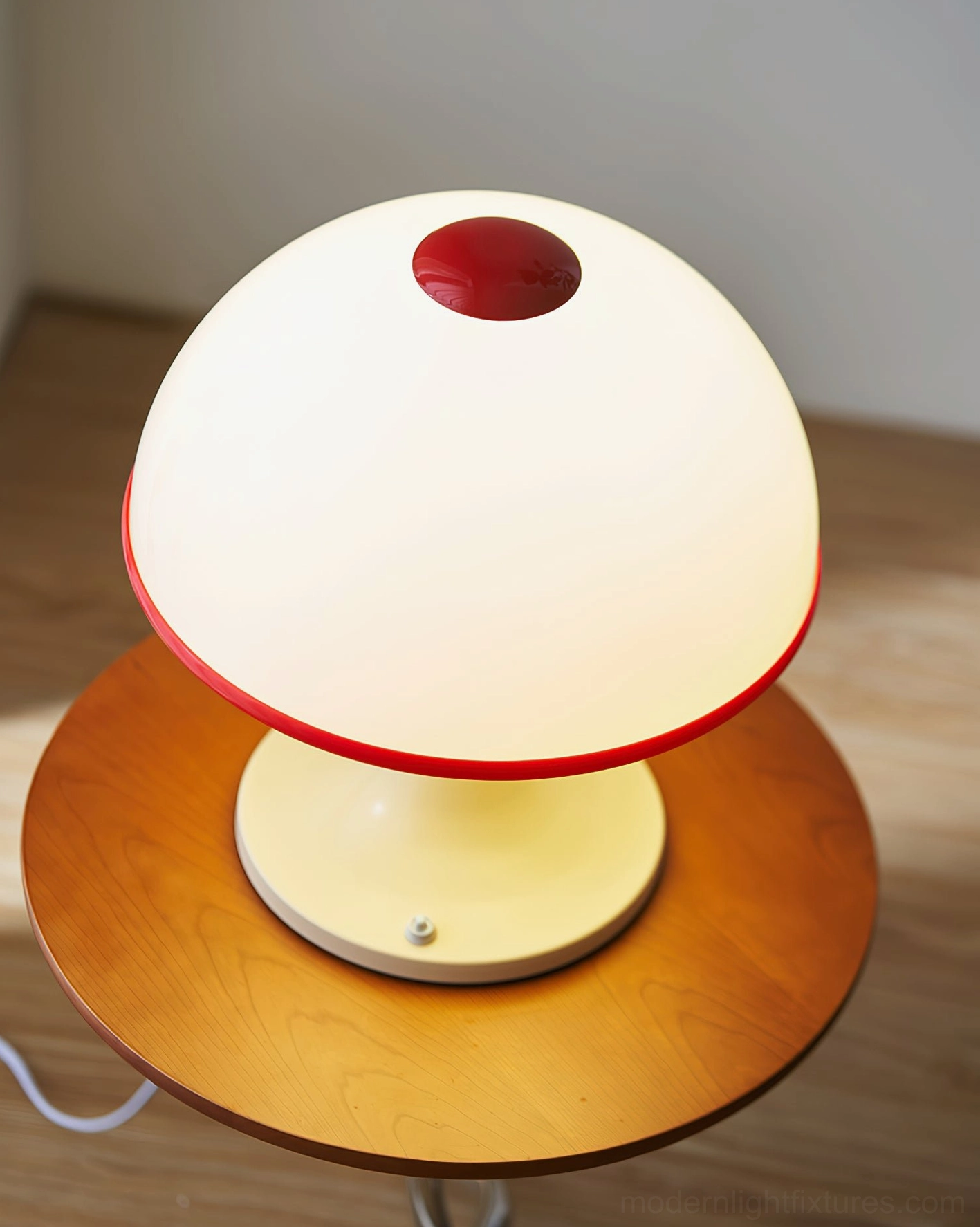 Mushroom table lamp close-up illuminated dome shade red contrast detail on wooden side table