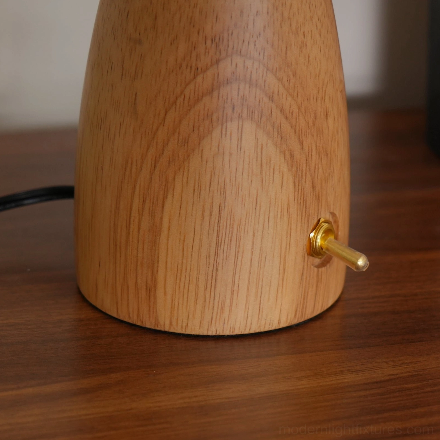 Mushroom table lamp side view with brass power switch and pleated shade detail