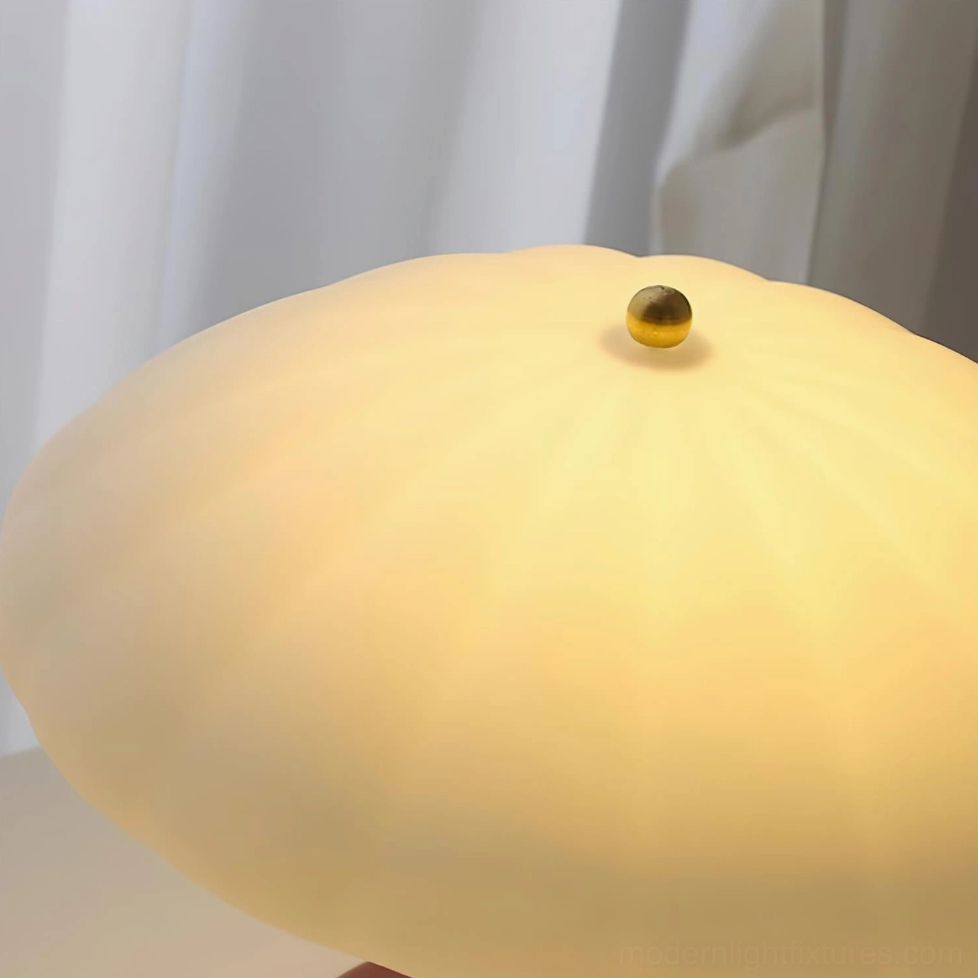 Mushroom table lamp positioned on nightstand beside bed, warm ambient lighting for bedroom relaxation and sleep environment