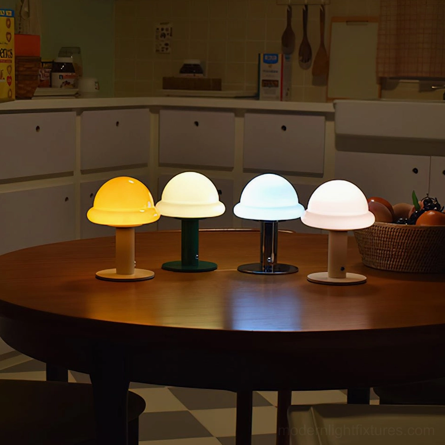 Multiple mushroom rechargeable table lamps in different colors arranged together showcasing design collection